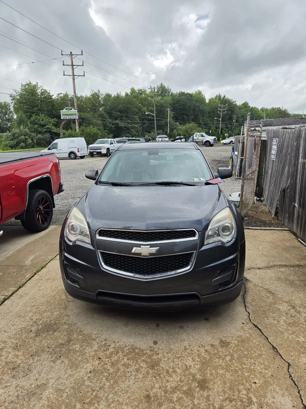 Freshly washed dark Chevrolet Equinox, front view