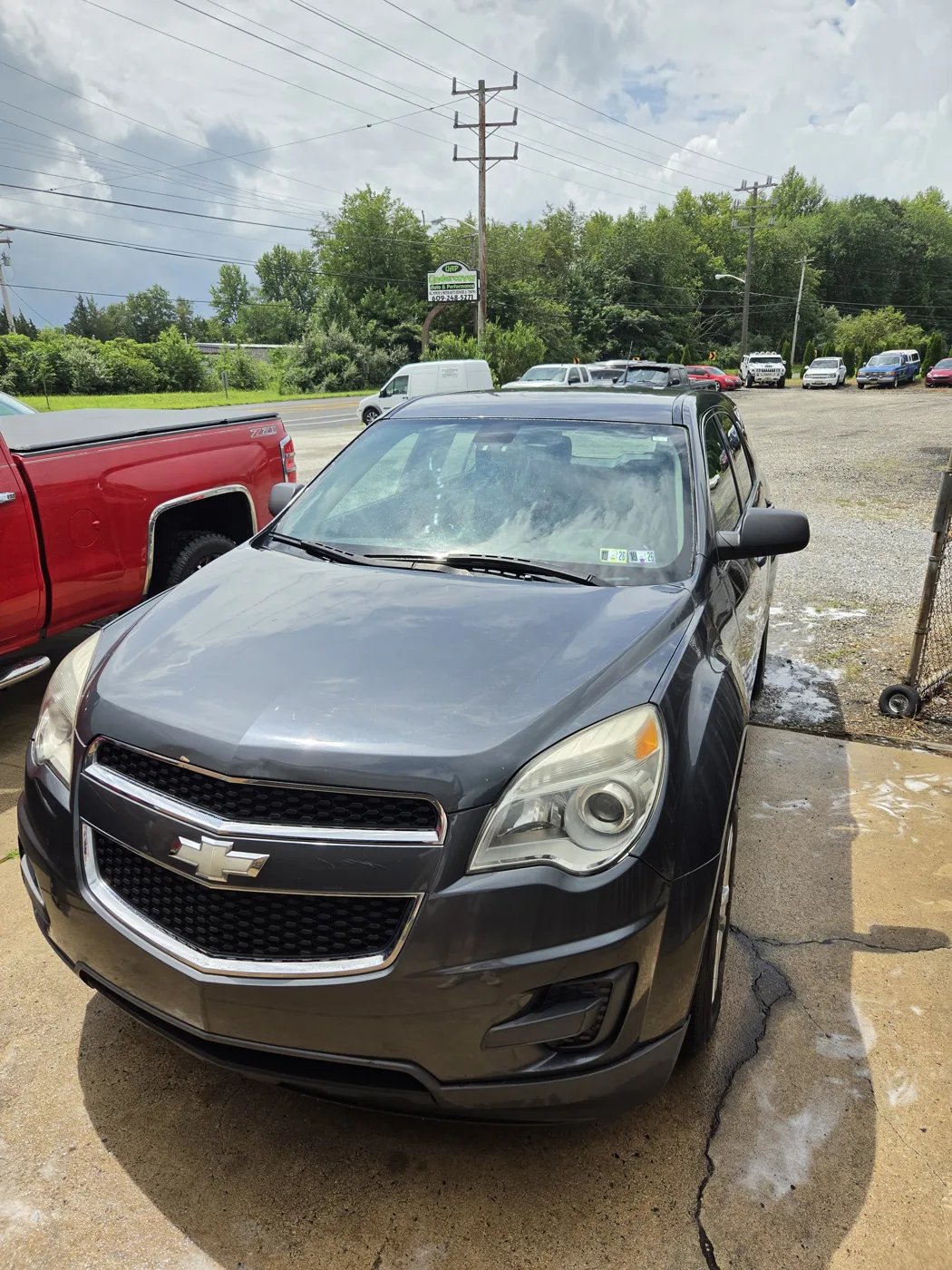 Detailed black Chevrolet Equinox gleaming after a wash